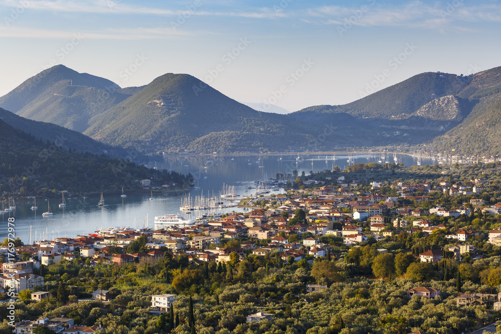 Morning view of Nydri village on Lefkada island with Ithaca and Kefalonia in the distance, Greece.
