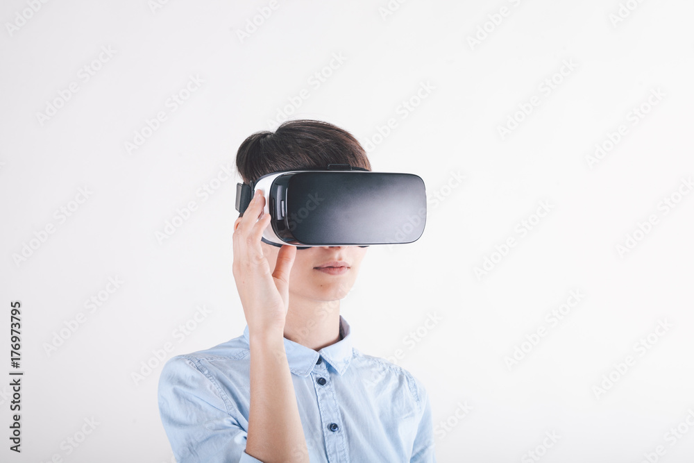 Girl in virtual reality headset looking to the left Girl in virtual reality headset looking to the left