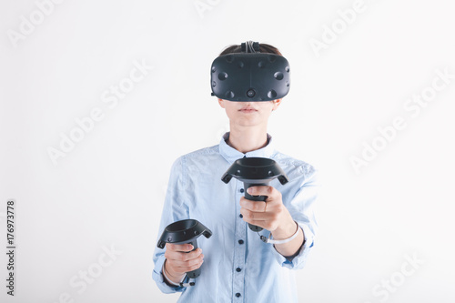 Girl in virtual reality headset on white background