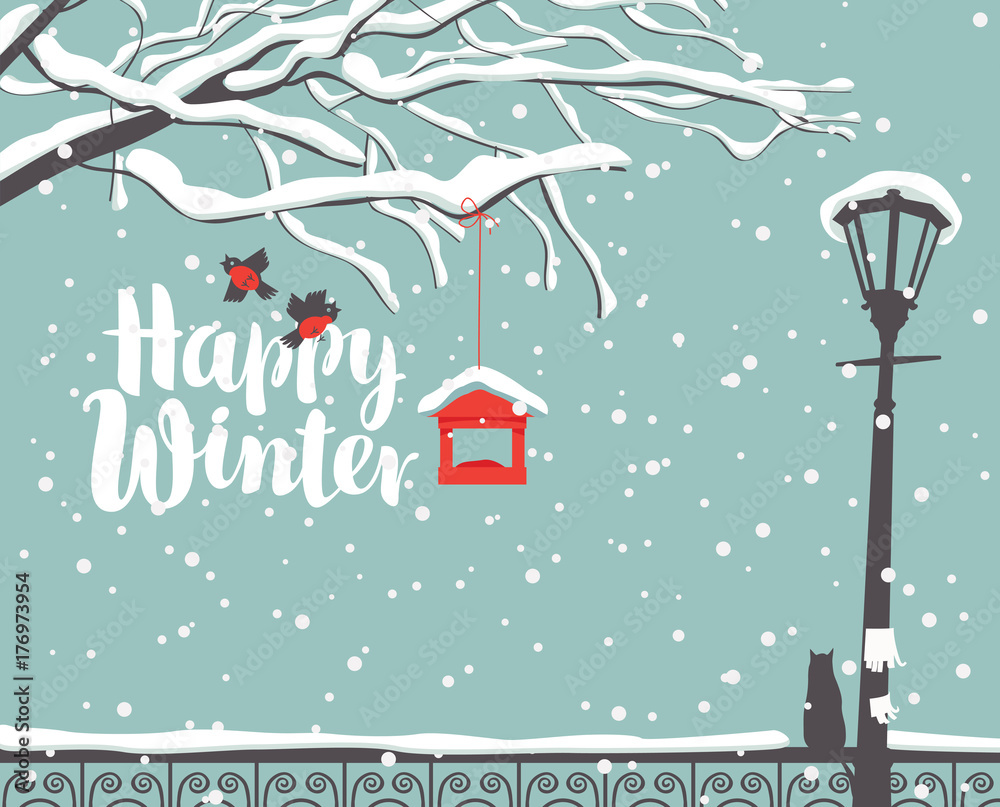 Fototapeta premium Vector winter scene at the snow-covered park with calligraphic inscription Happy Winter, with branches of a tree, bullfinches and a bird feeder, a street lamp and a cat on the fence in the snow