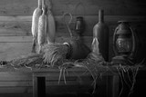 Still Life image of Lanterns and other things on the wooden plank in the old barn
