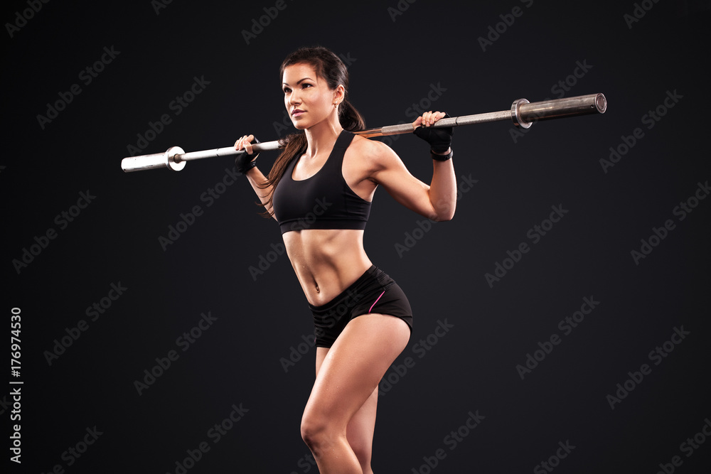 Sporty anf fit beautiful woman exercising workout training with barbell. Fitness motivation. Sporty anf fit beautiful woman exercising workout training with barbell. Fitness motivation.