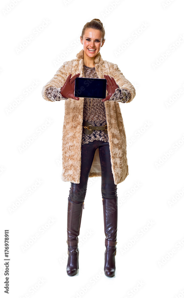 smiling fashion-monger on white showing phone blank screen