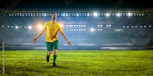 Soccer player at stadium. Mixed media