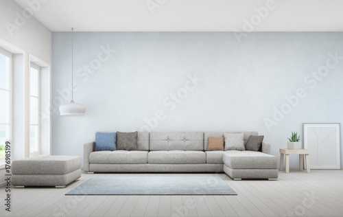 Indoor plant on wooden coffee table and big sofa with empty blue concrete wall background, Relaxing area near window in sea view living room of modern luxury beach house - Home interior 3d rendering