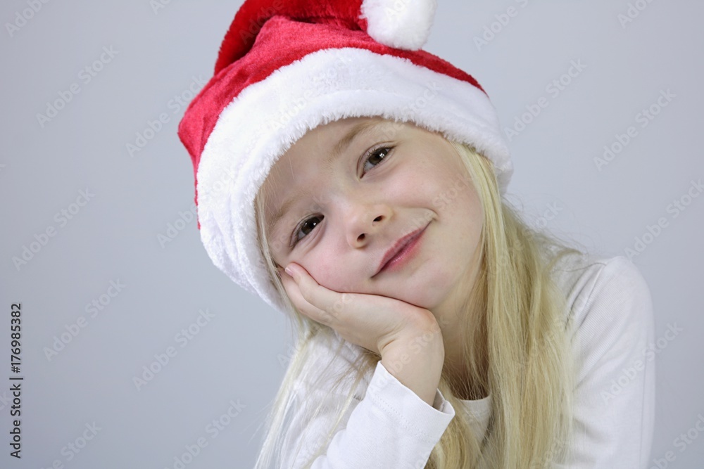 Kind mit Weihnachtsmütze Kind mit Weihnachtsmütze