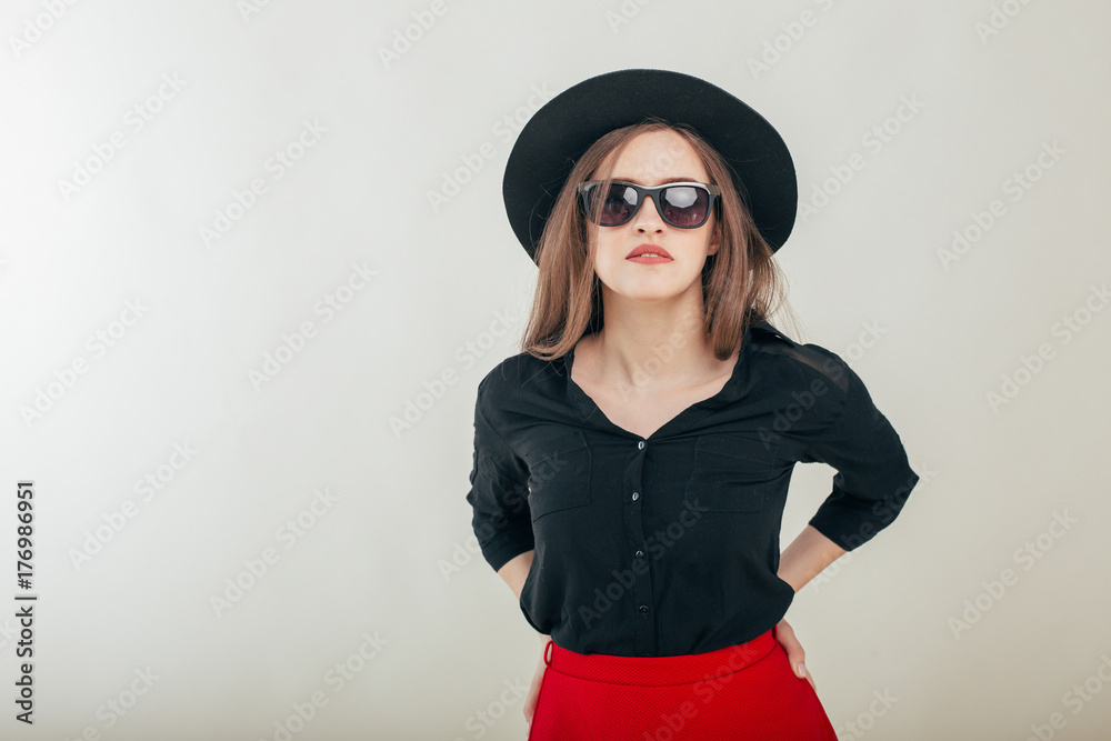 Young beautiful fashionable woman with trendy makeup in black hat and glasses on the grey background . Model looking at camera, wearing stylish eyeglasses. Female fashion, beauty concept.
Young beautiful fashionable woman with trendy makeup in black hat and glasses on the grey background . Model looking at camera, wearing stylish eyeglasses. Female fashion, beauty concept.