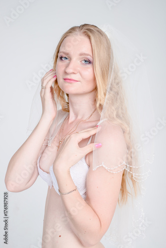 young bride girl in lingerie and lace veil
