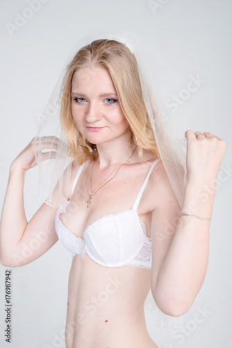 young bride girl in lingerie and lace veil 