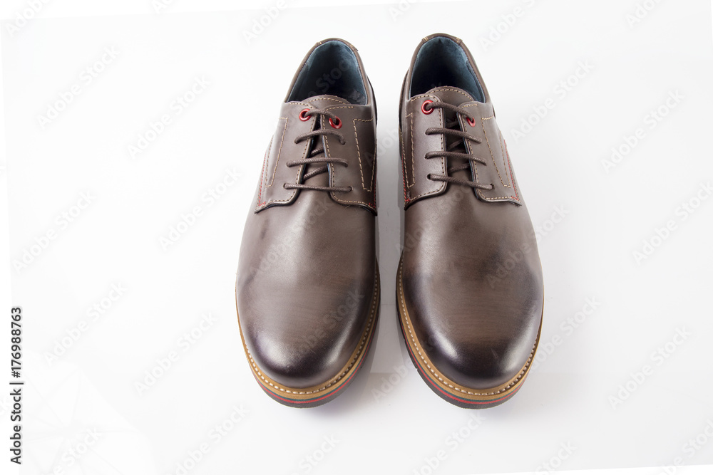 Male brown leather shoes on white background, isolated product, comfortable footwear. Male brown leather shoes on white background, isolated product, comfortable footwear.