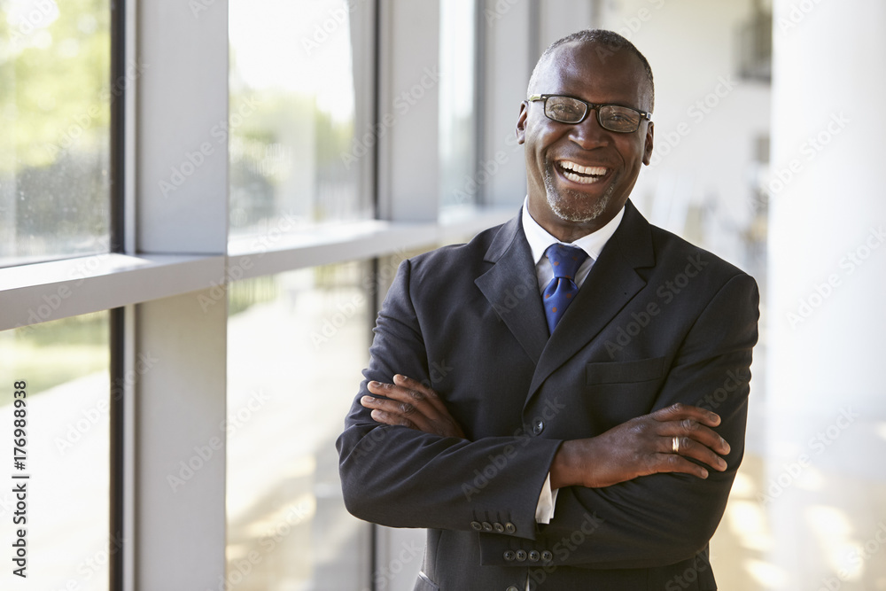 Portrait of a smiling businessman with arms crossed Portrait of a smiling businessman with arms crossed