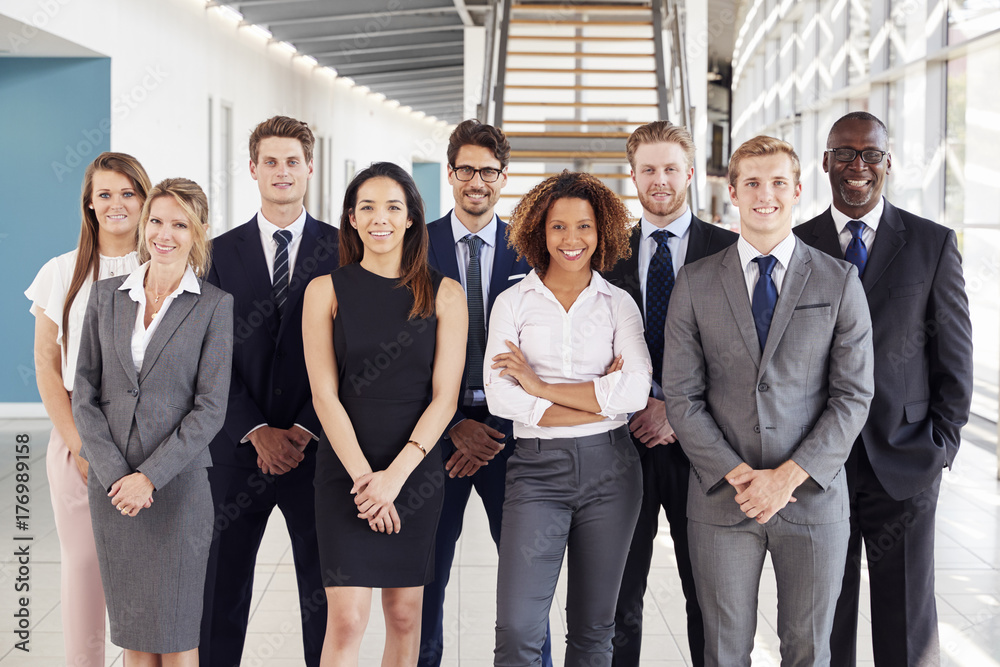 Office workers in a modern lobby, group portrait Office workers in a modern lobby, group portrait