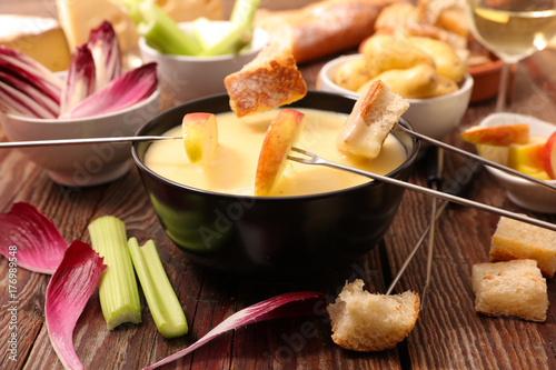 cheese fondue with bread and vegetable