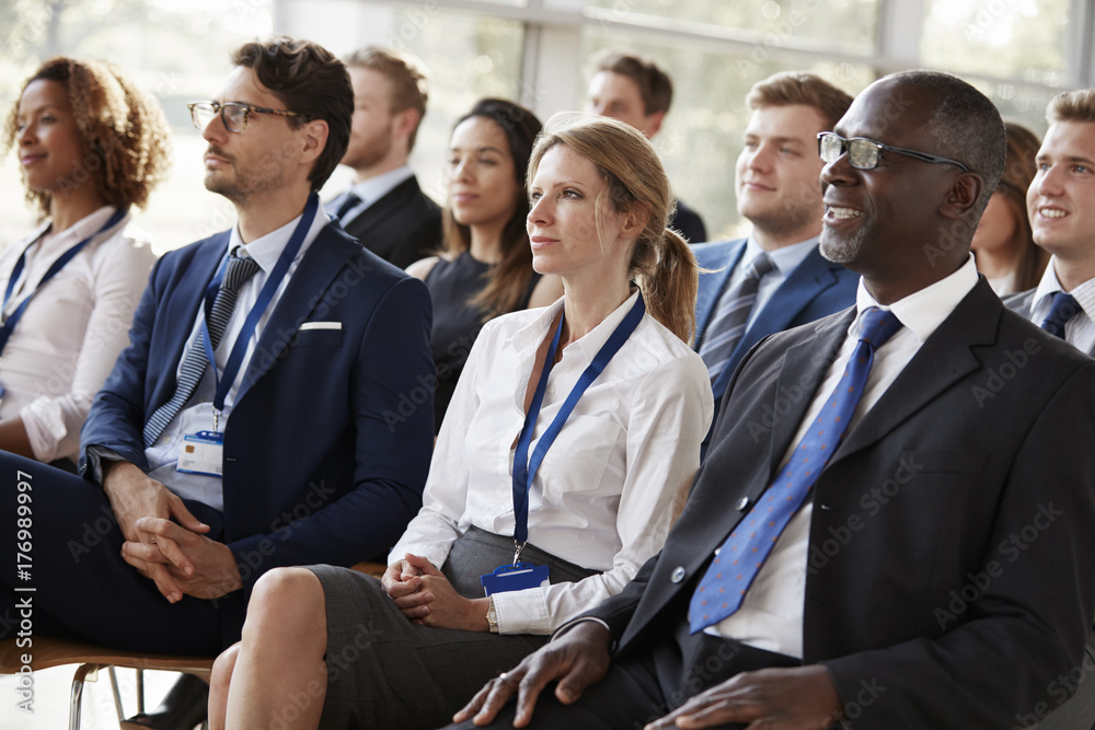 Audience watching a business conference Audience watching a business conference