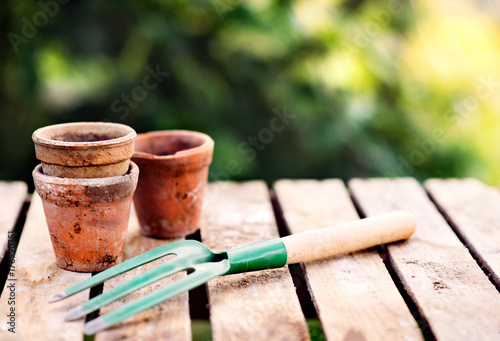 Garden tool and flower pots in the garden.