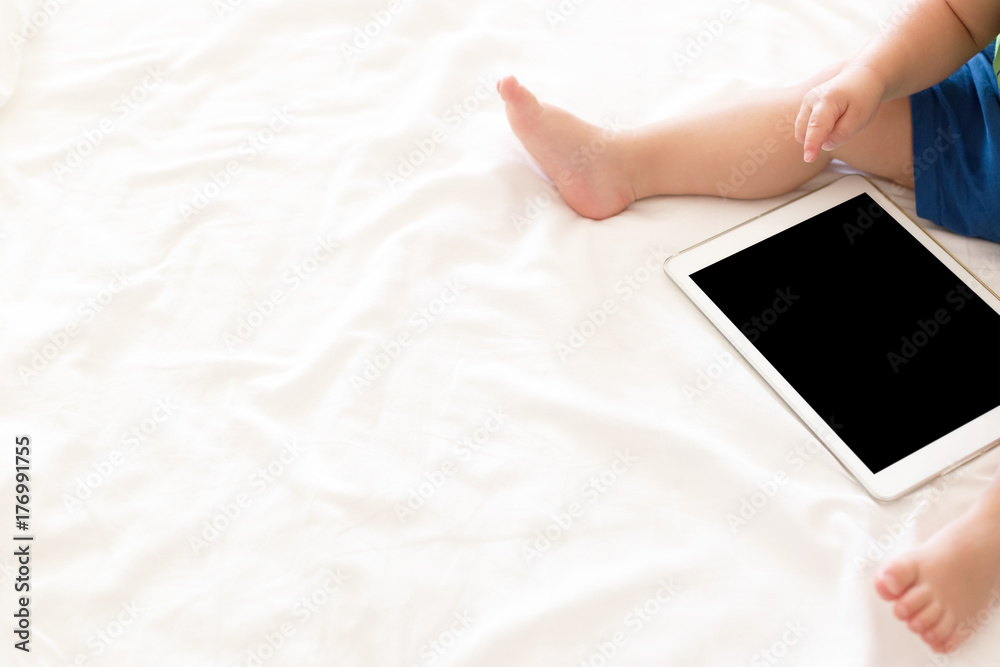 Cute baby with a tablet, copy space image Cute baby with a tablet, copy space image