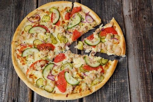 Delicious pizza with chicken cheese and vegetables