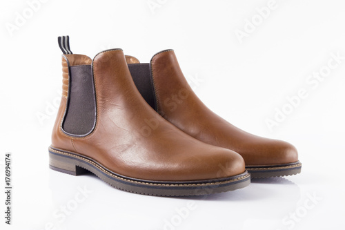 Male brown leather boot on white background, isolated product, Footwear.