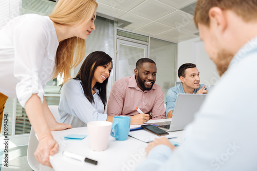 Attentive woman checking her colleagues