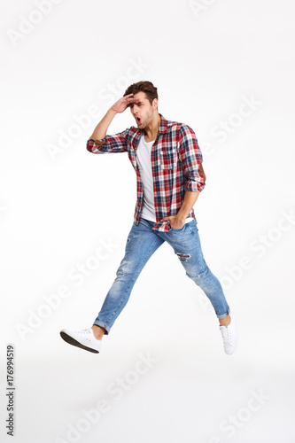 Full length portrait of a young funny man