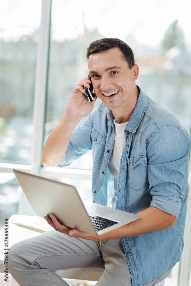 Cheerful brunette being at his favorite work Cheerful brunette being at his favorite work