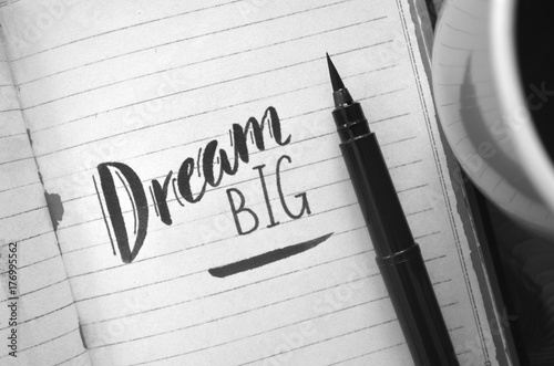 DREAM BIG motivational quote written in notebook