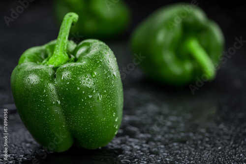 Fresh made Green paprika on a slate slab (close-up shot; selective focus)