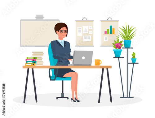 Girl, in strict clothes, working at computer in the office.