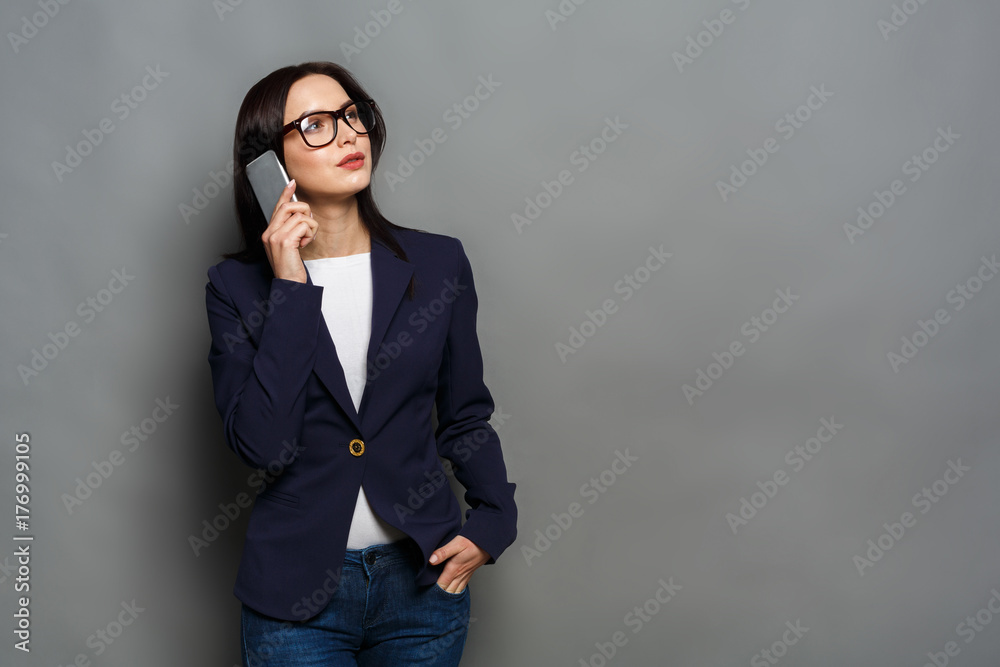 Young caucasian businesswoman calls mobile phone Young caucasian businesswoman calls mobile phone