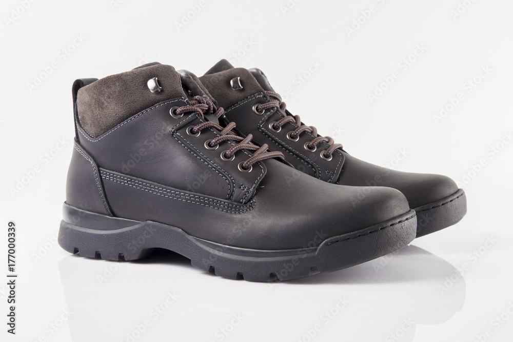 Male black leather boot on white background, isolated product, Footwear. Male black leather boot on white background, isolated product, Footwear.