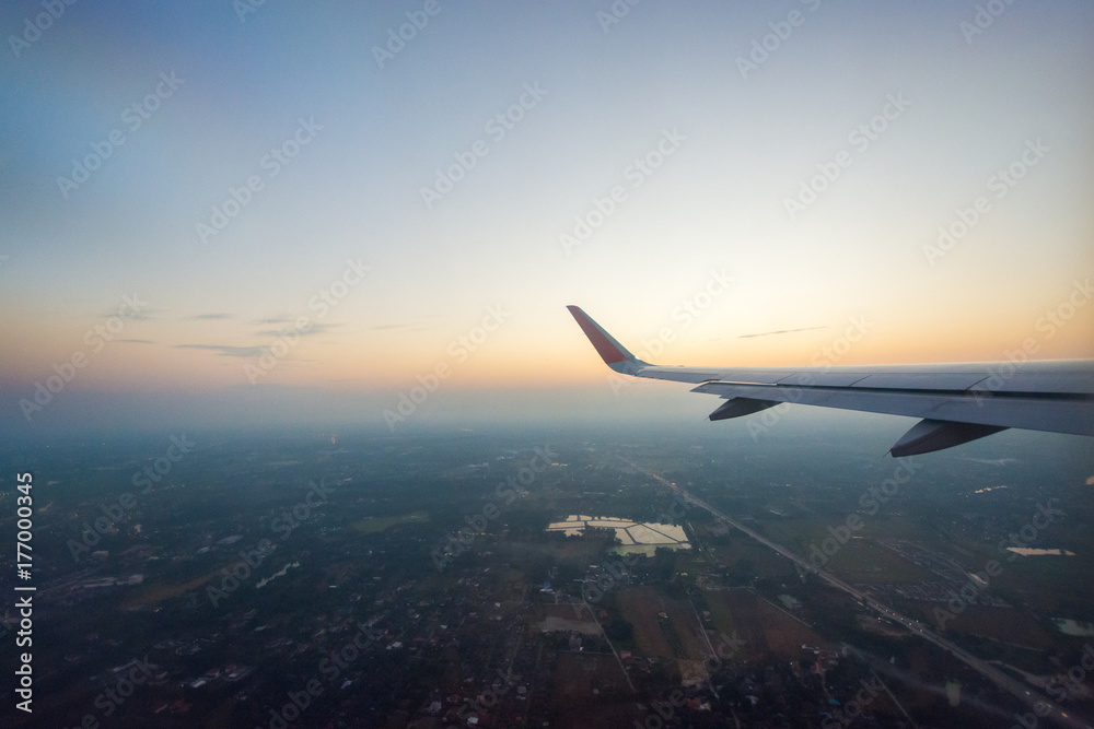Fototapeta premium Sunrise sky from airplane window
