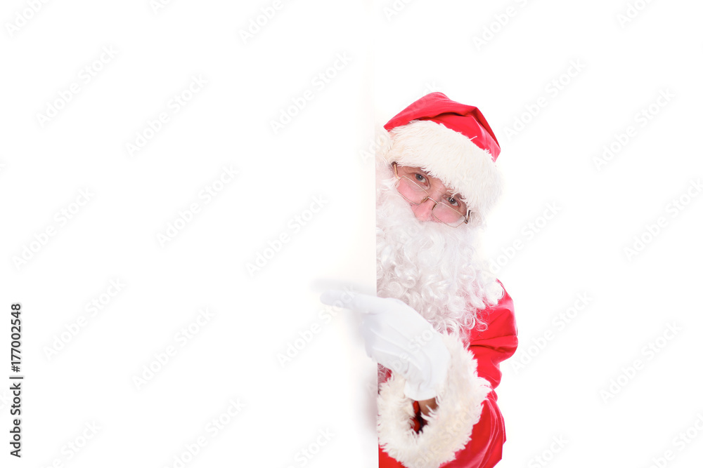 Kind Santa Claus pointing in white blank sign, isolated on white background Kind Santa Claus pointing in white blank sign, isolated on white background