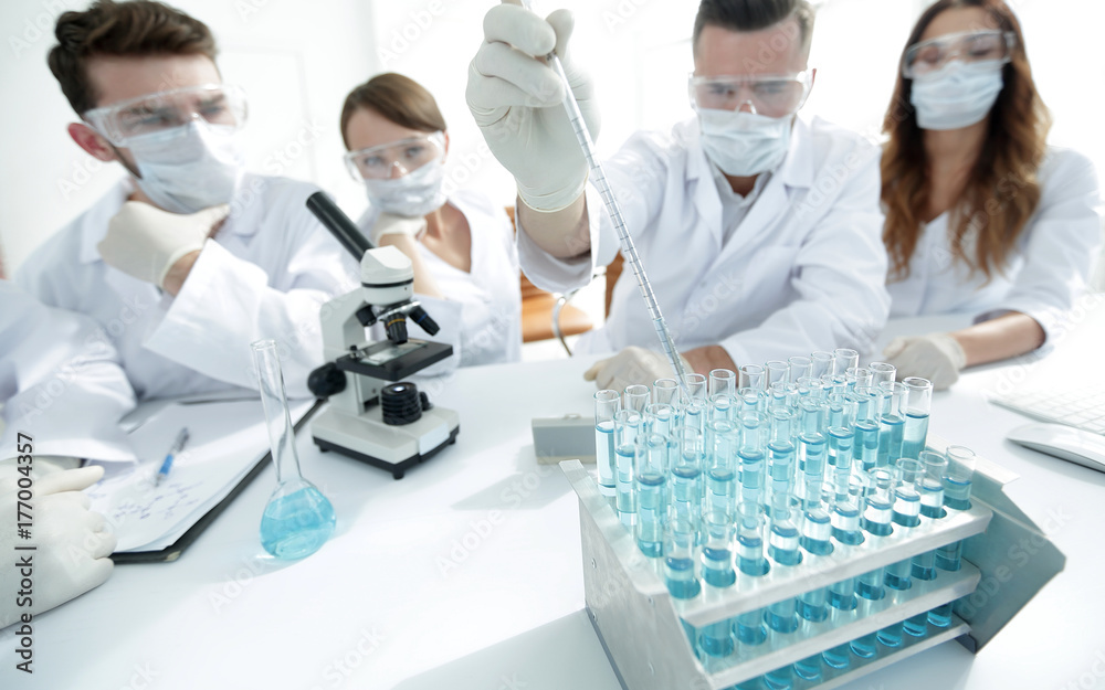 Scientists at chemical laboratory during work Scientists at chemical laboratory during work