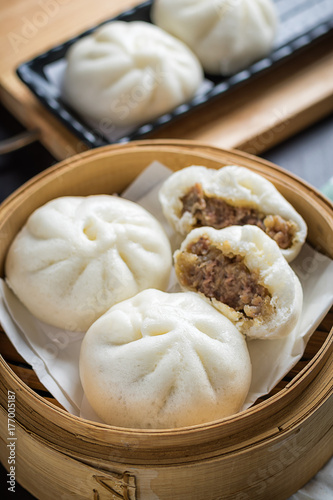 chinese steamed buns on wood container , selective focus