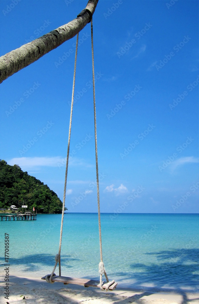 Swing on a Deserted Beach in Thailand on a Sunny Day