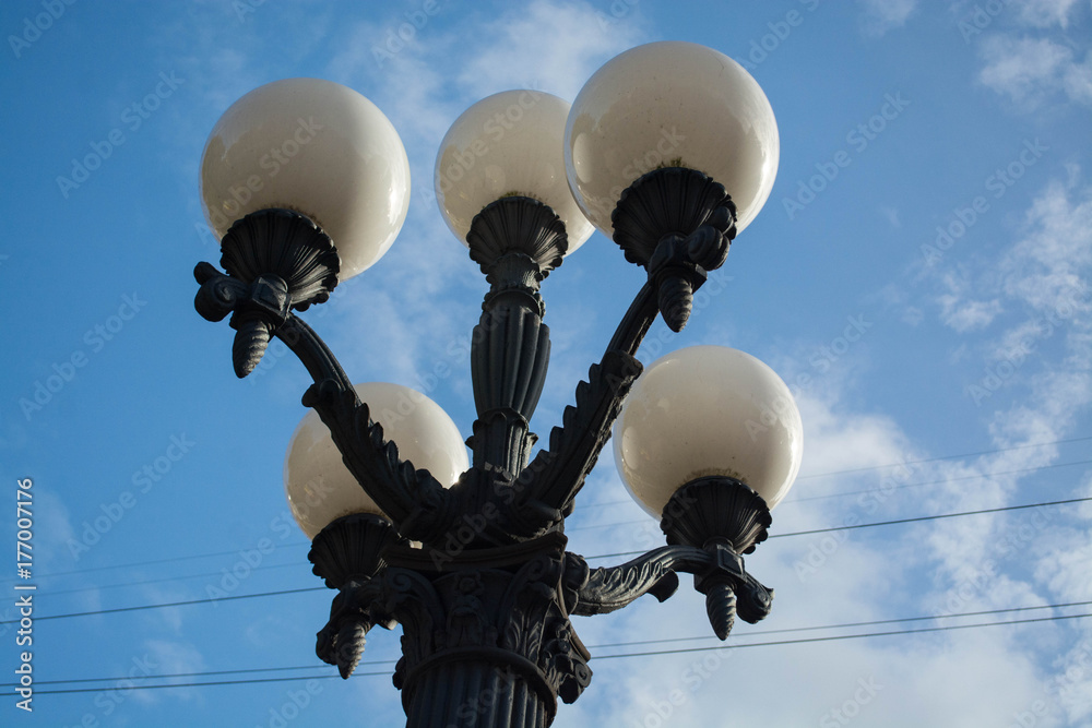 Decorative street lamp and golden autumn in a city park. Latvia, Riga. Decorative street lamp and golden autumn in a city park. Latvia, Riga.