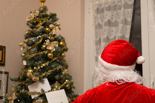 Wallpaper Mural Santa Claus behind with tree in the background Torontodigital.ca