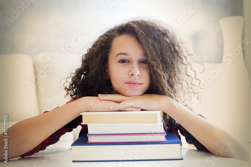 Happy curly hair teen girl ...