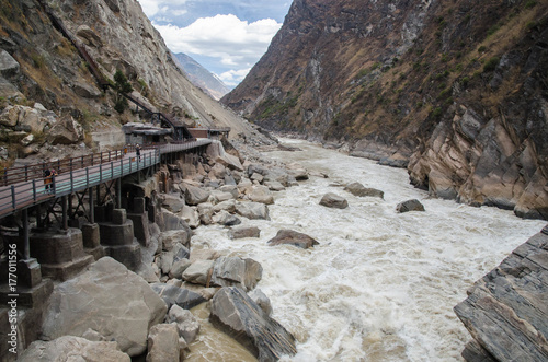 The torrential flow through the hills in Tibet photo