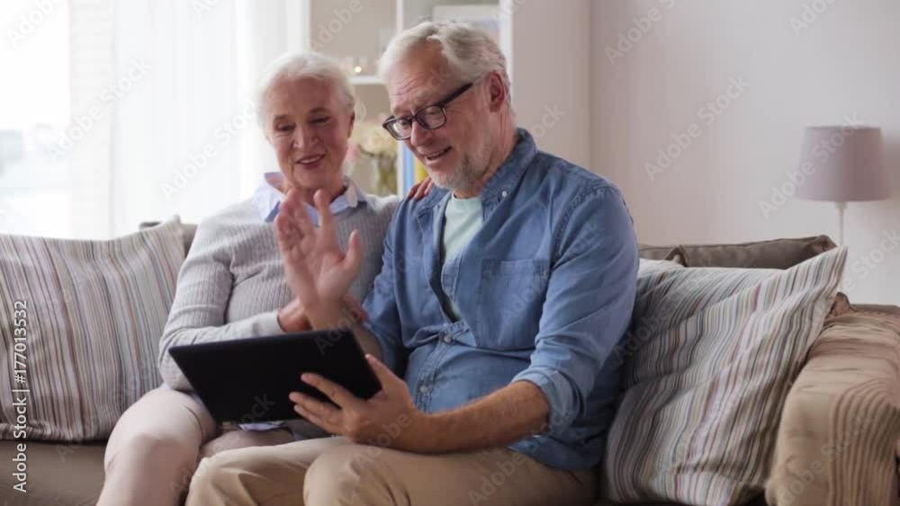 senior couple having video chat on tablet pc senior couple having video chat on tablet pc