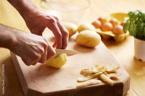 Cutting potatoes photo
