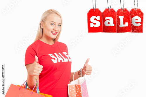  happy young woman  carrying shopping bags