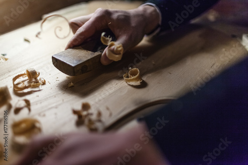 Violin maker at work . photo