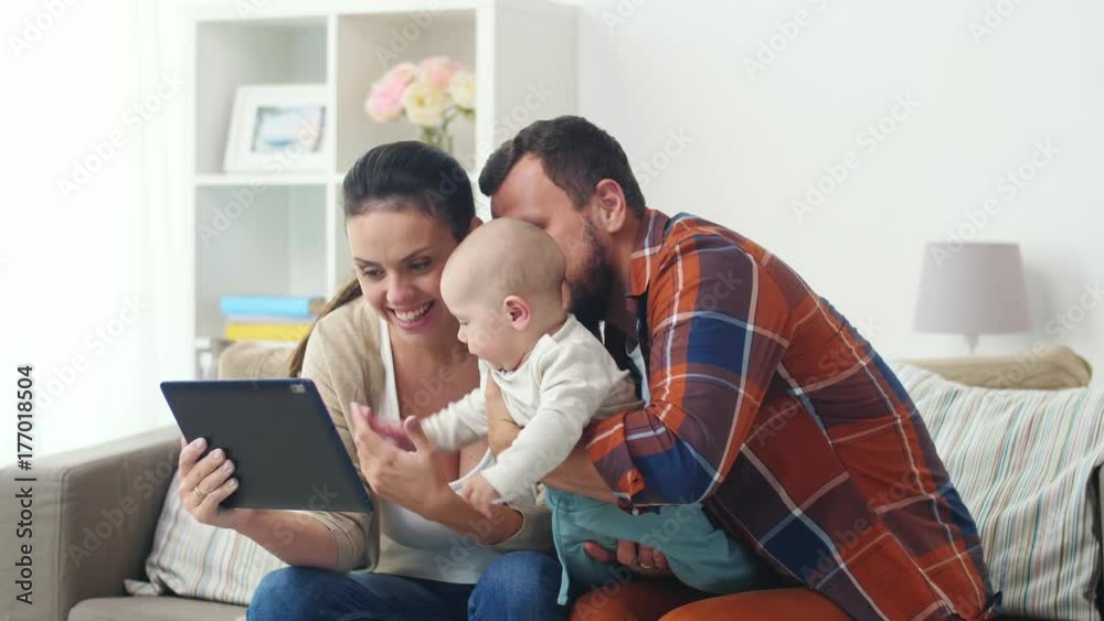 mother, father and baby with tablet pc at home mother, father and baby with tablet pc at home
