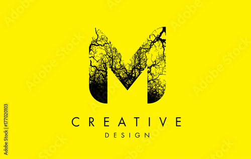 M Logo Letter Made From Black Tree Branches