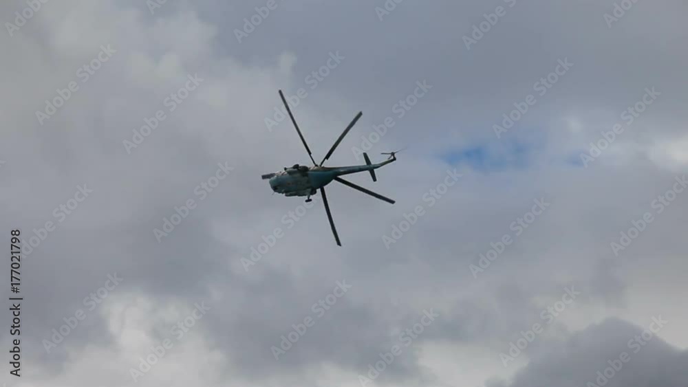 Russian army Mi-8 helicopter in action against cloudy sky Russian army Mi-8 helicopter in action against cloudy sky