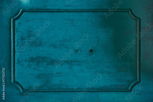Old painted blue door fragment background