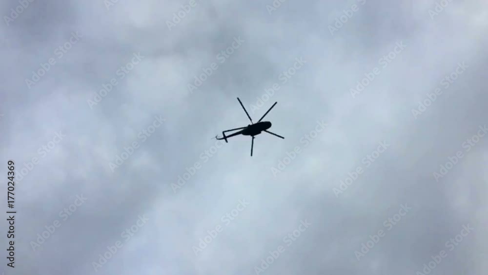 The helicopter is flying in cloudy conditions The helicopter is flying in cloudy conditions