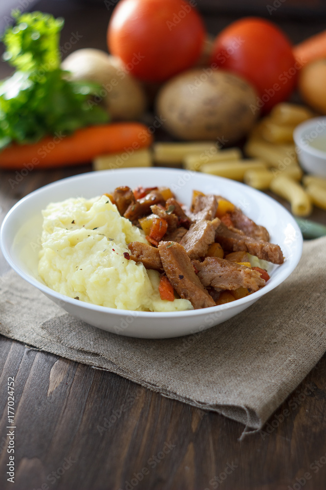 Soy meat with potato puree over kitchen table. Soy meat with potato puree over kitchen table.