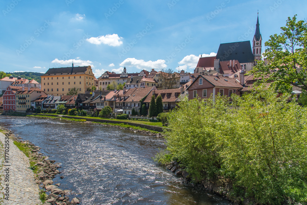 Cesky Krumlov city view in middle of the sunny day with river in town